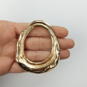 Dije con forma irregular